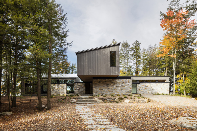 boxy modern house with trees nearby