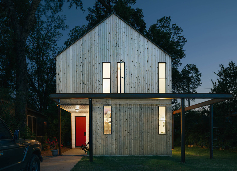 modern house exterior with trees in the background