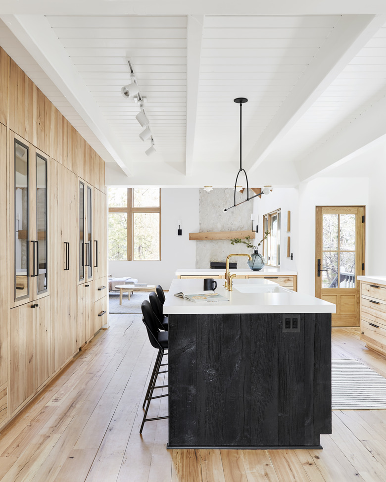 modern kitchen cabinet idea with floor-to-ceiling wood cabinets to match wood floor