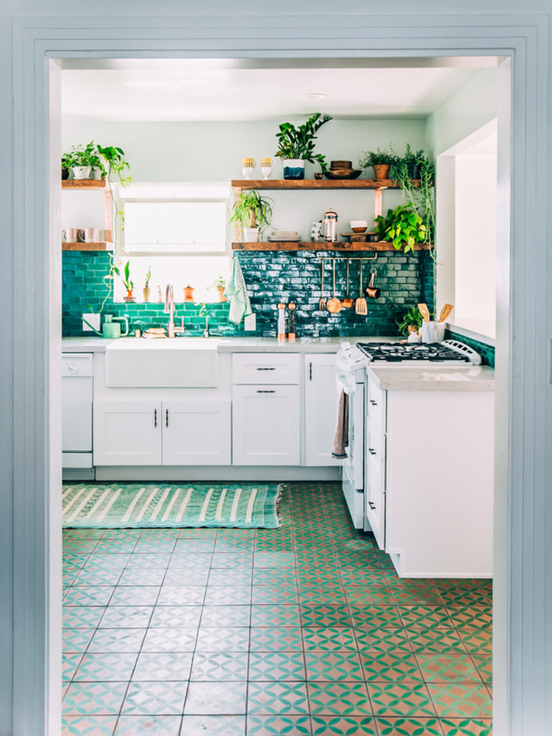 Turquoise and tan tile modern kitchen flooring in bohemian kitchen