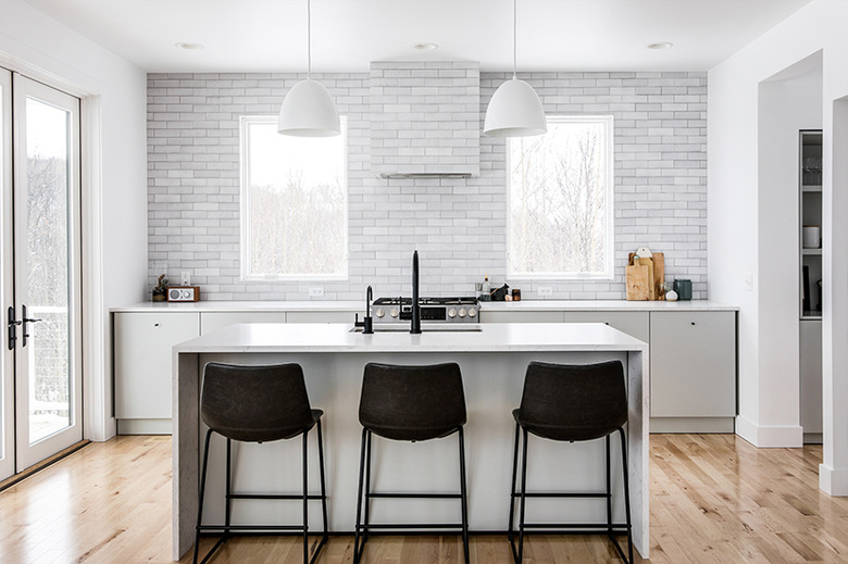 Hardwood modern kitchen flooring with short planks and contemporary decor