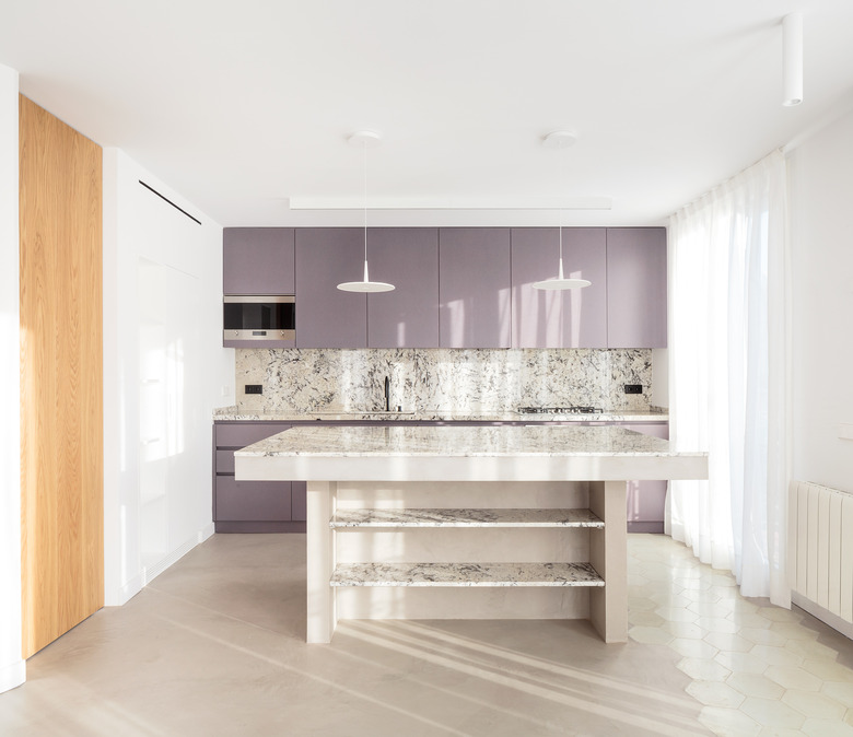 modern kitchen island with thick countertop and open shelving