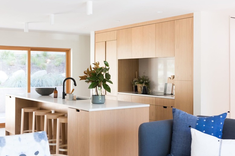 modern kitchen island in wood with white countertop