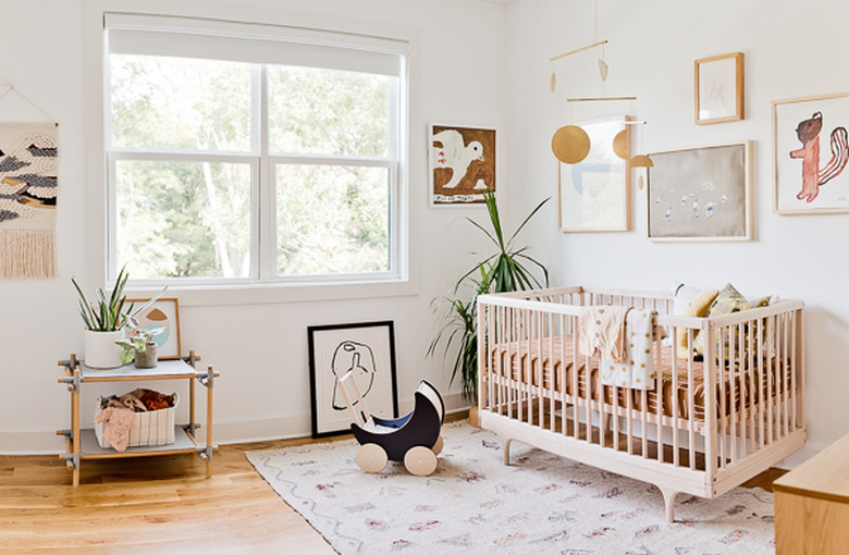 eclectic modern nursery idea with cute gallery wall