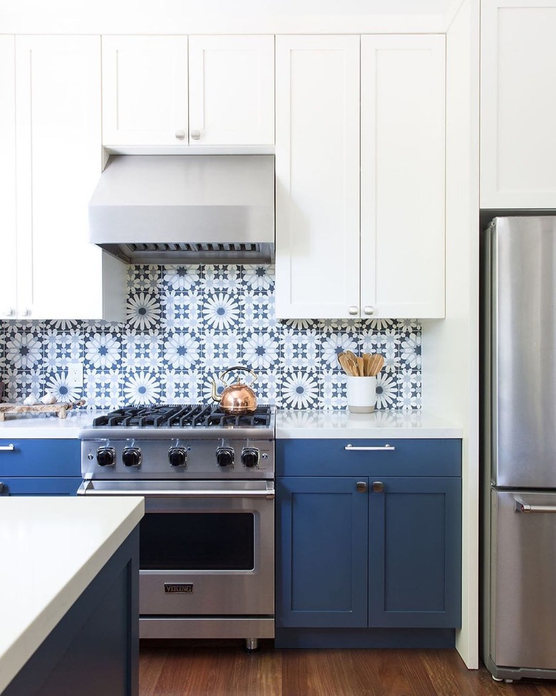 Blue and white Moroccan tile backsplash with blue and white cabinets