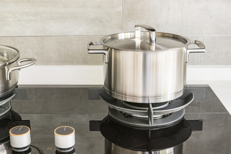 Gas stove and stainless steel pot in kitchen