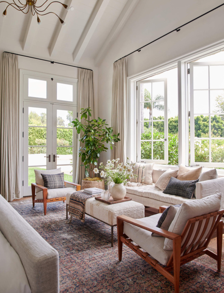 natural decor in gray and white living room with sofa and two chairs