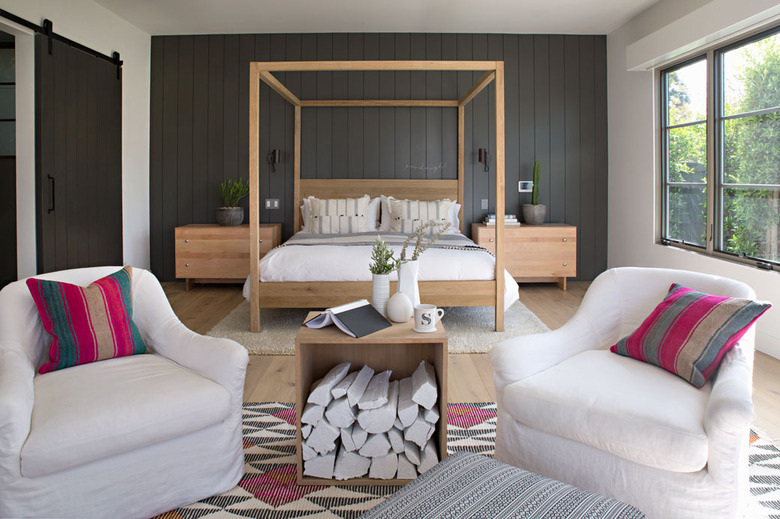 black and white bedroom idea with canopy bed and sliding barn door