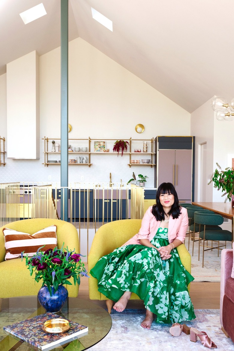 blogger Joy Cho sitting in the living room of her studio