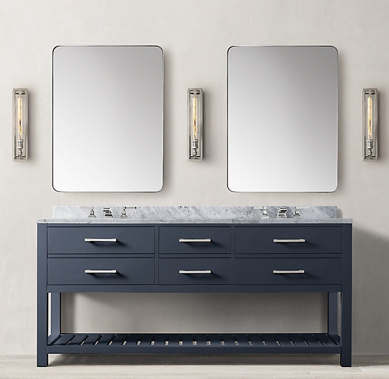 navy bathroom double vanity with two rectangular mirrors and three light sconces