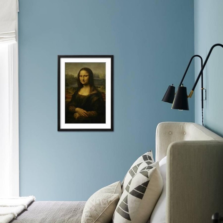 mona lisa poster on light blue wall