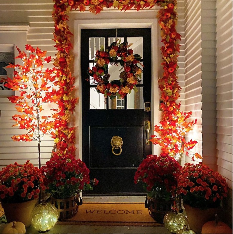 outdoor fall display illuminated at night