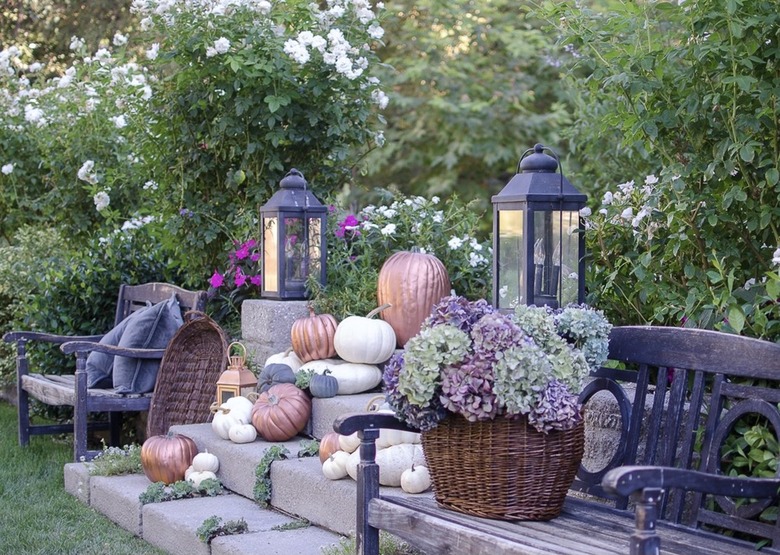 cascading pumpkins display sprinkled with copper gourds