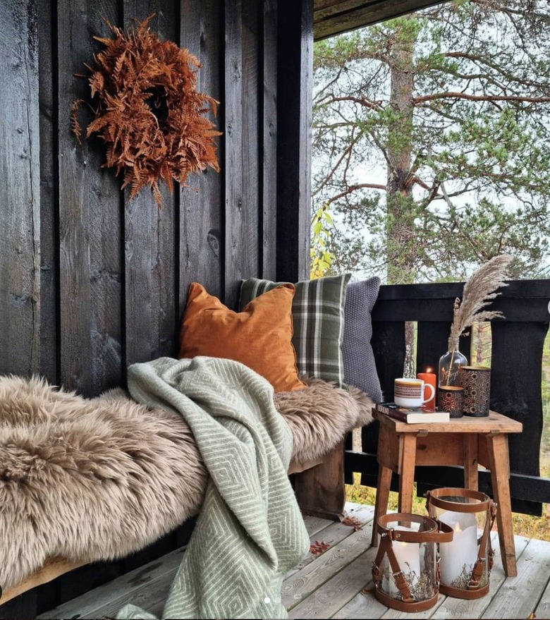 porch with cot and shearling throw