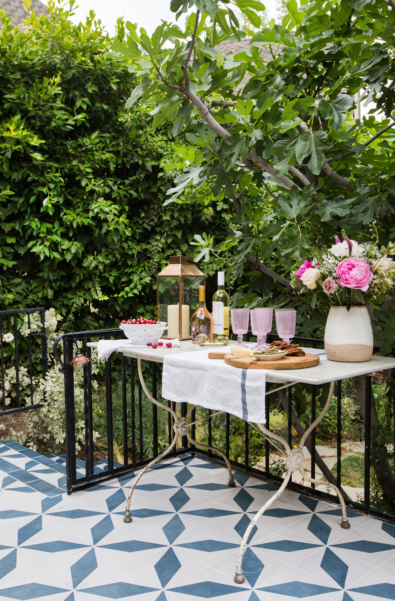 outdoor party idea with pink and white food and drink table station