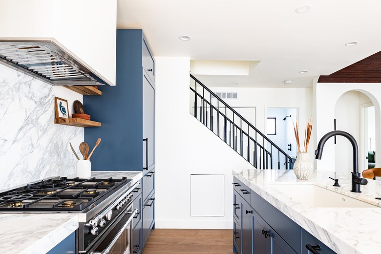 blue and white kitchen with gas oven range