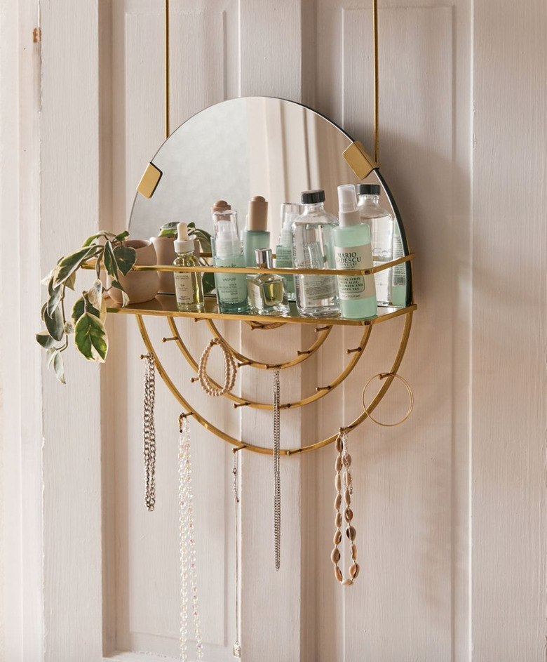 Over the Door Storage with Hanging organizer with mirror, necklaces, beauty supplies, plant.