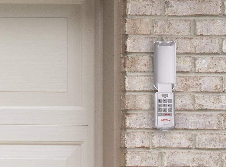 Overhead Door wireless garage door keypad on brick garage exterior