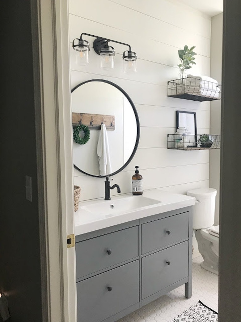 Farmhouse bathroom with basket shelves.