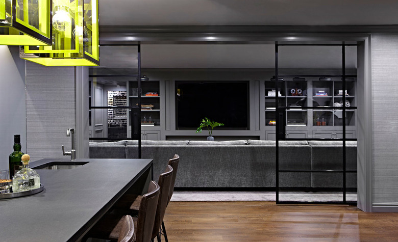 painted basement ceiling in dark gray with lime green lamps