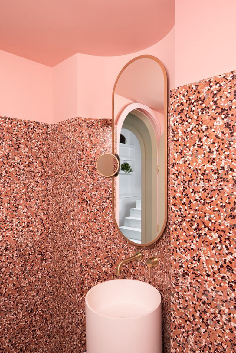 pink bathroom with terrazzo walls