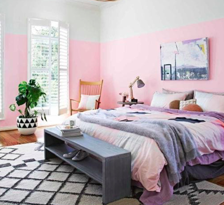 pink bedroom with bed bench and rocking chair