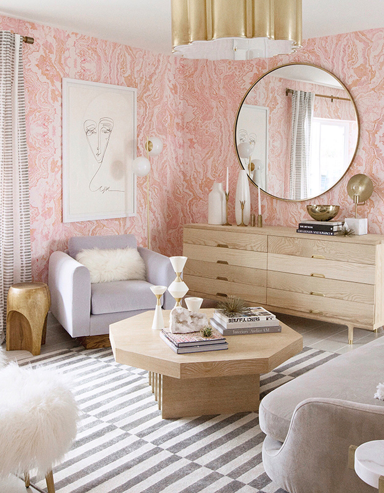 pink agate wallpaper with gold ceiling light and light wood furniture