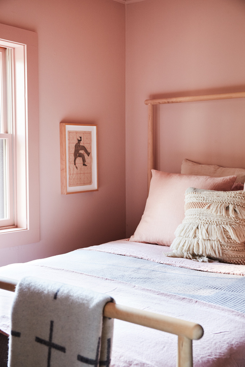 bedroom with pink walls and pink bedding