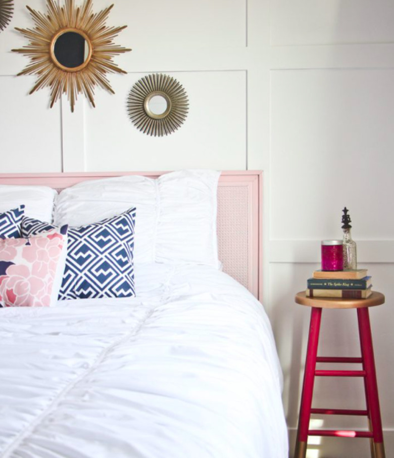 pink guest bedroom idea with DIY side table and pink headboard