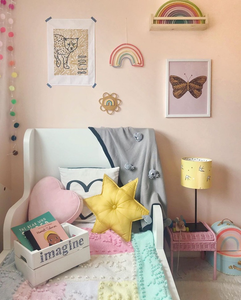 pink walls in kids bedroom idea gallery wall and playful pillows