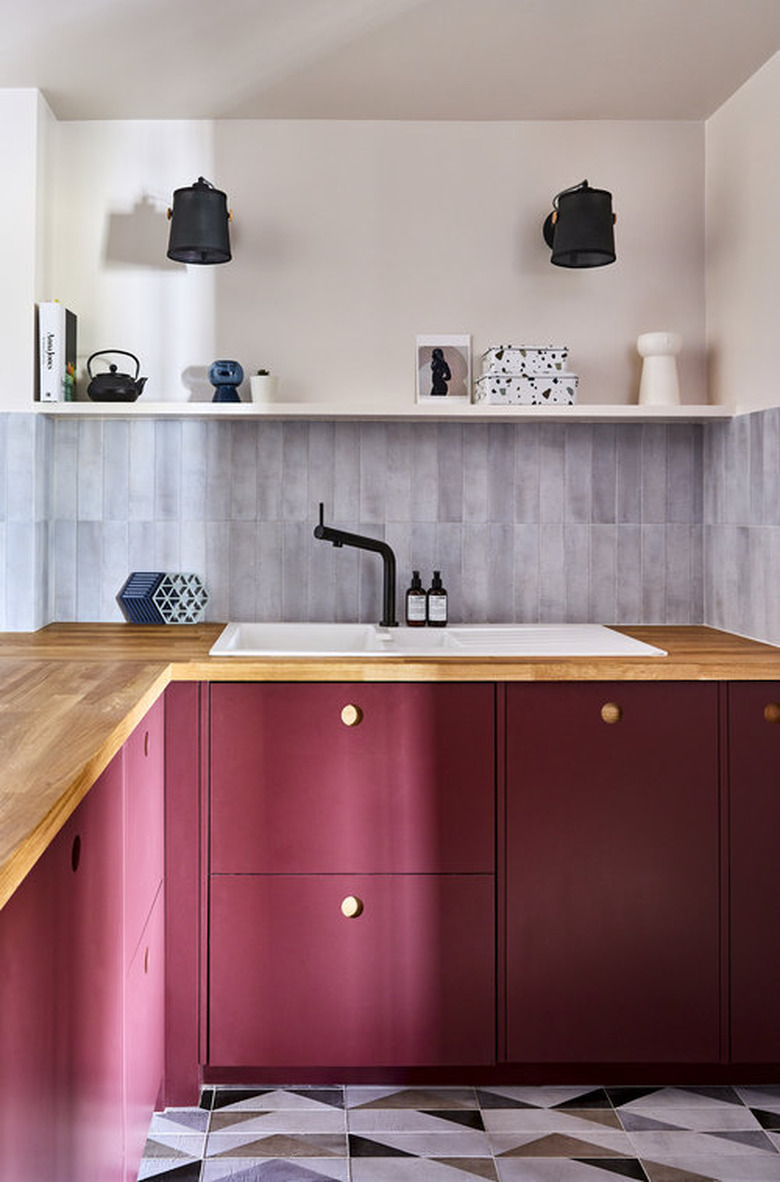 pink kitchen color idea with magenta cabinets and cement tile floor