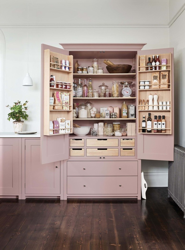 kitchen with pink cabinetsand white countertop