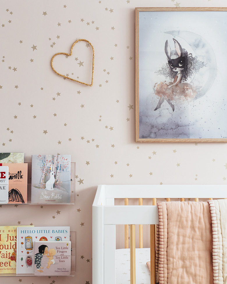 pink nursery idea with blush pink star wallpaper and white crib