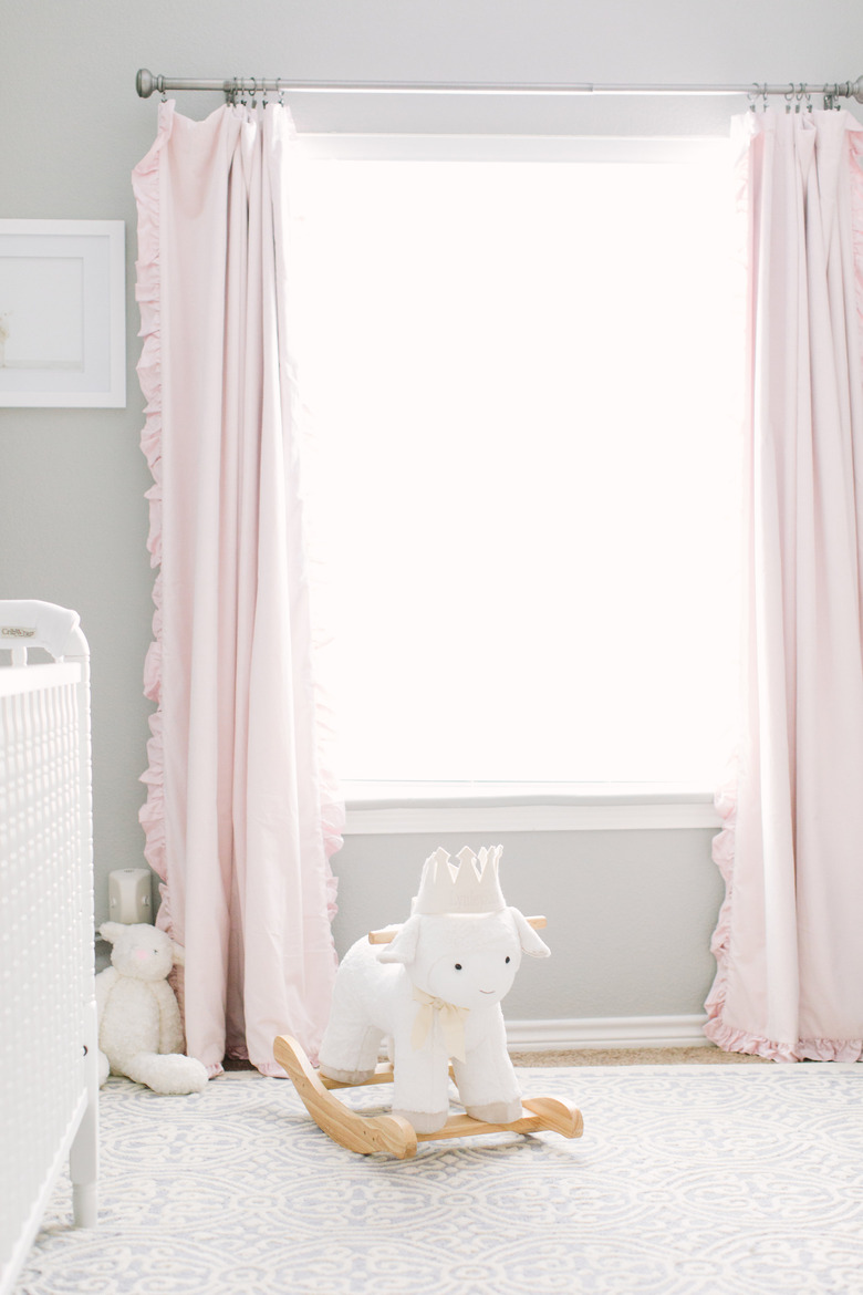 pretty pink and gray nursery idea with pink drapery and white crib