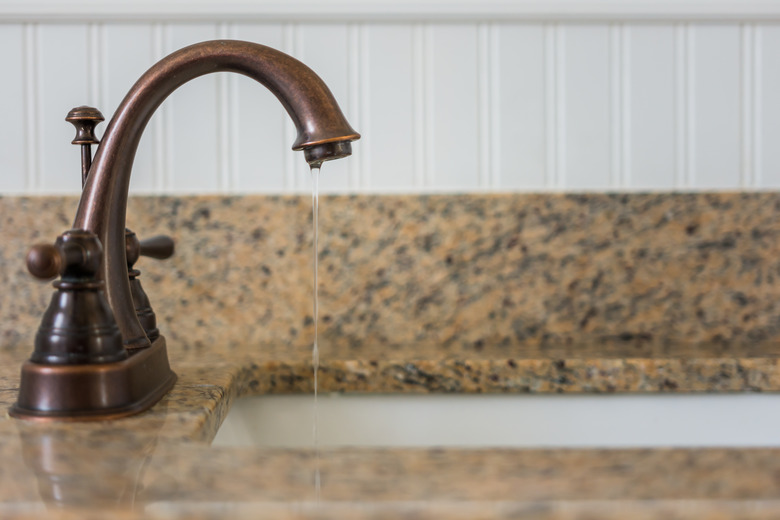 Bronze bathroom vanity faucet and sink