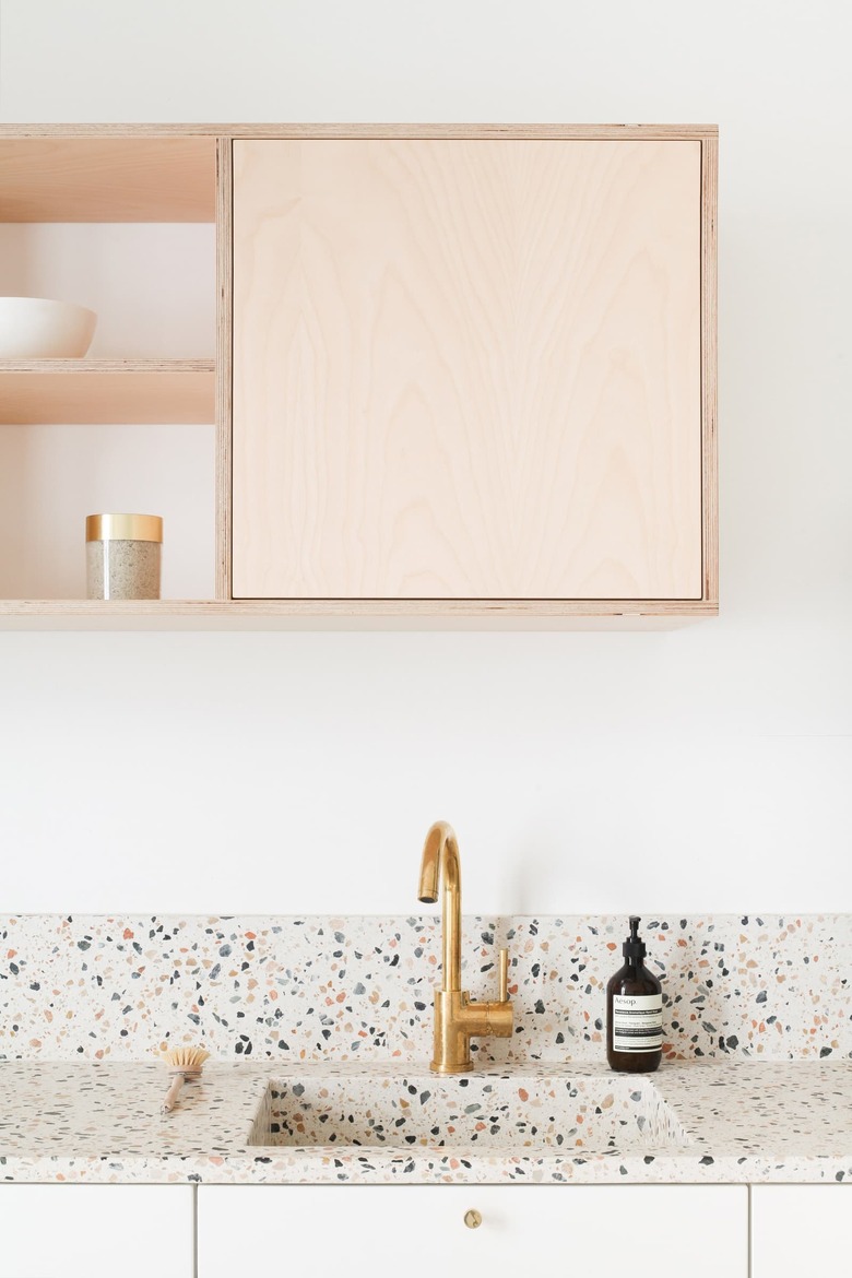 Scandinavian kitchen with terrazzo countertop and integrated sink