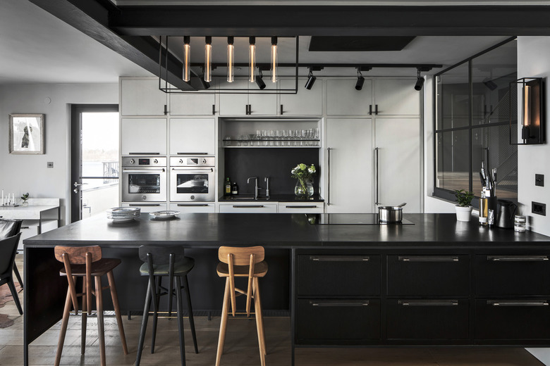 black kitchen countertops in industrial kitchen