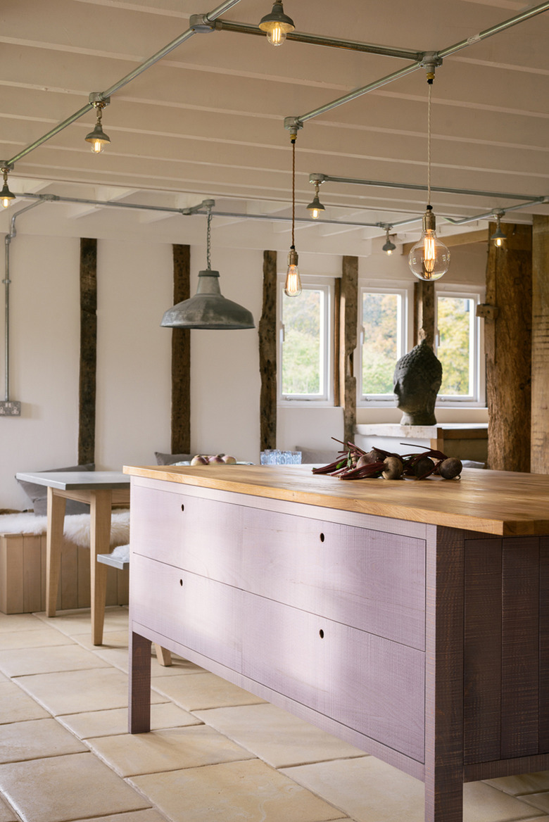 purple kitchen color idea with wood countertops and tile flooring