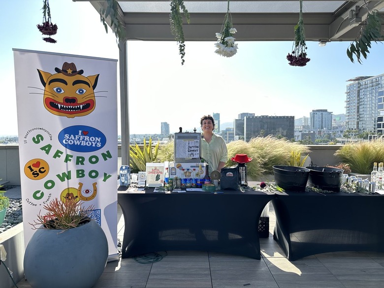 Outdoor photo of a coffee station with a sign that reads 