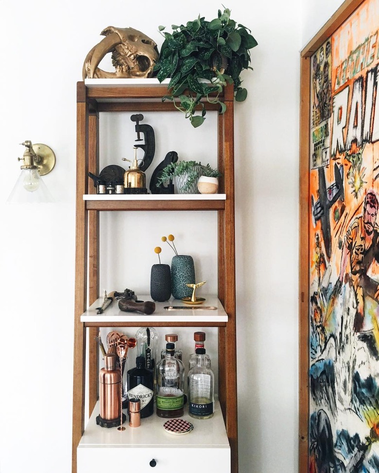 living room bar idea with bohemian shelving and oversize poster print