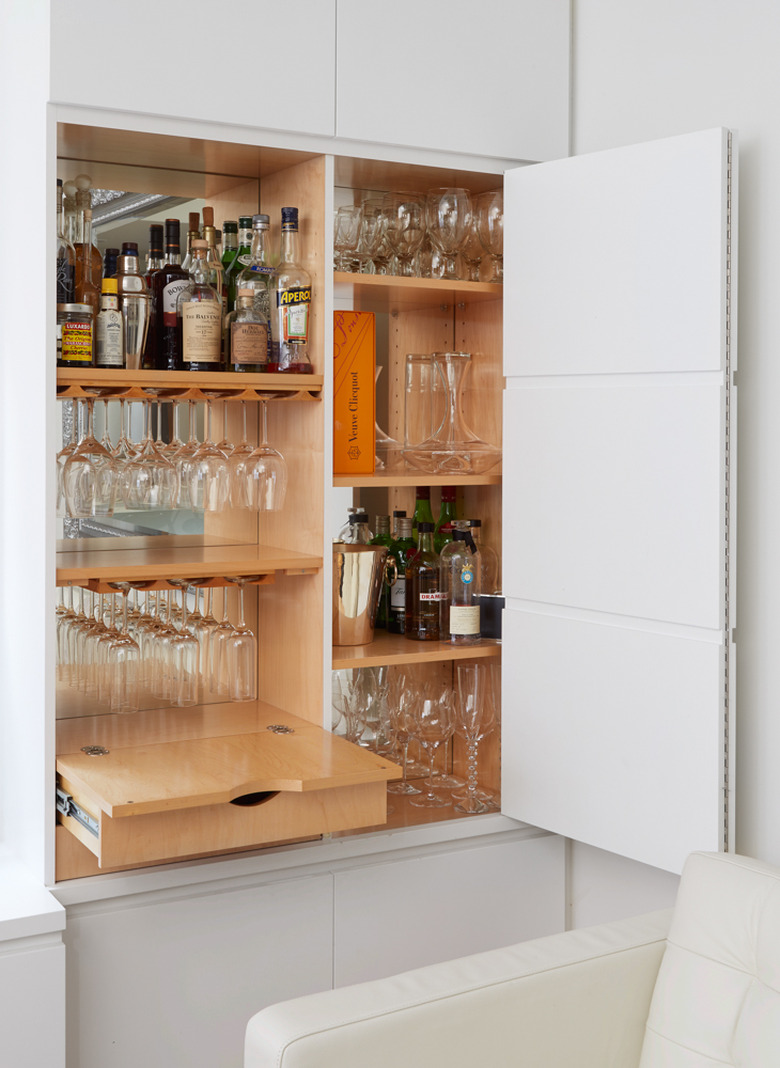 living room bar idea in built-in cabinet with shelving and drawers