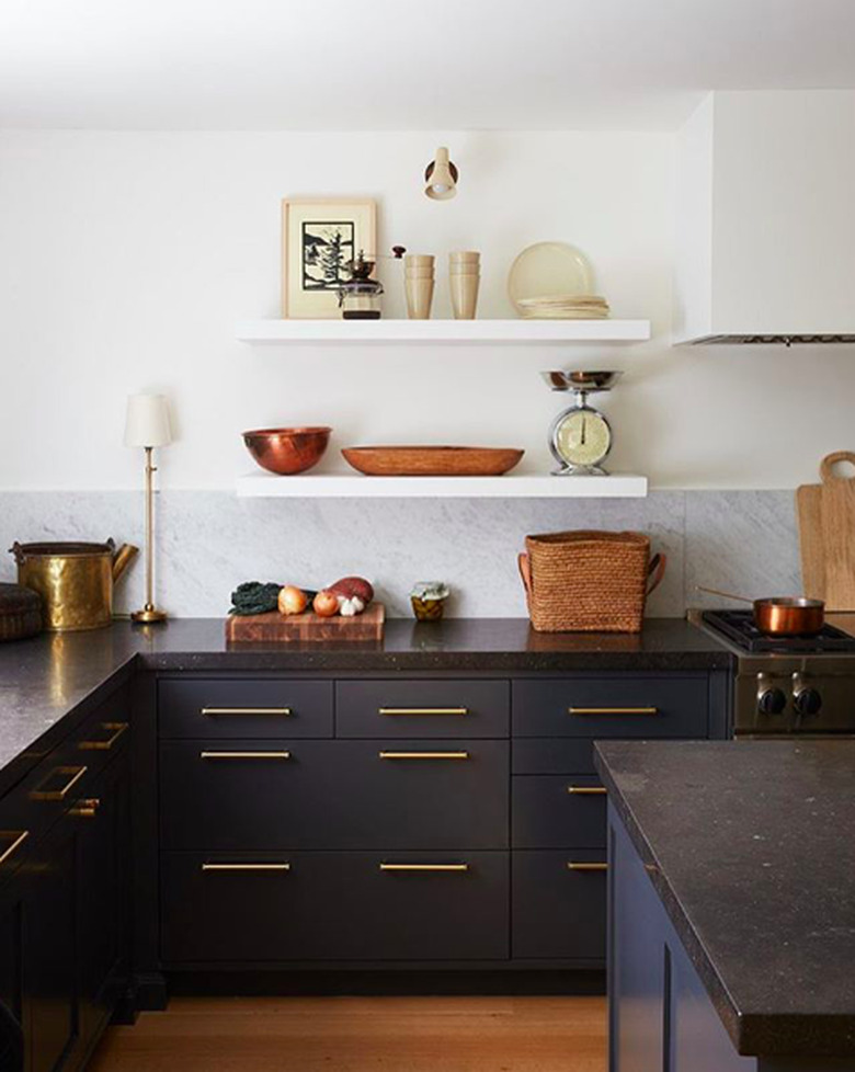 limestone countertops in kitchen with navy blue cabinets