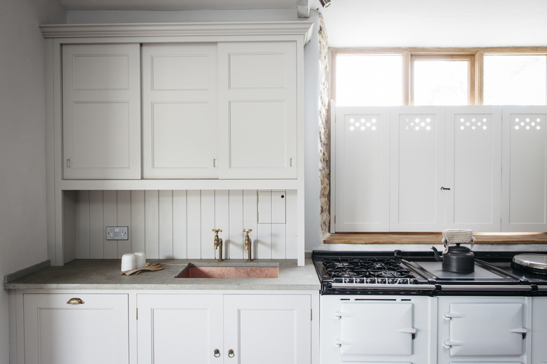 limestone countertops in white kitchen