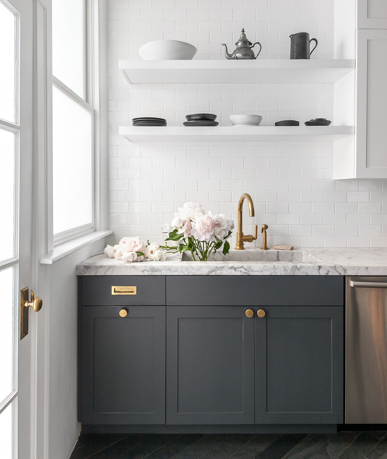 modern kitchen with gray wood cabinets and subway tile backsplash