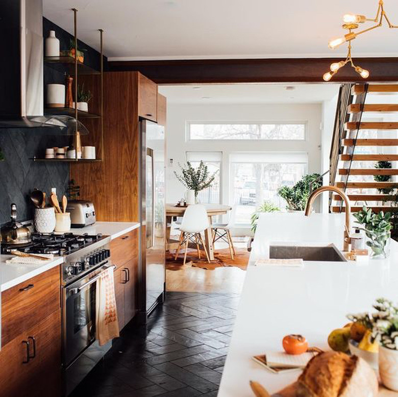 modern kitchen with dark wood cabinets and open shelving