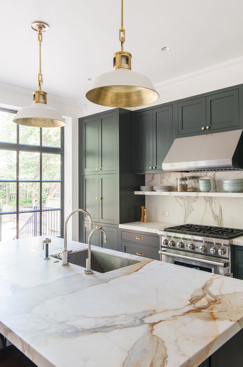 modern kitchen with dark green wood cabinets