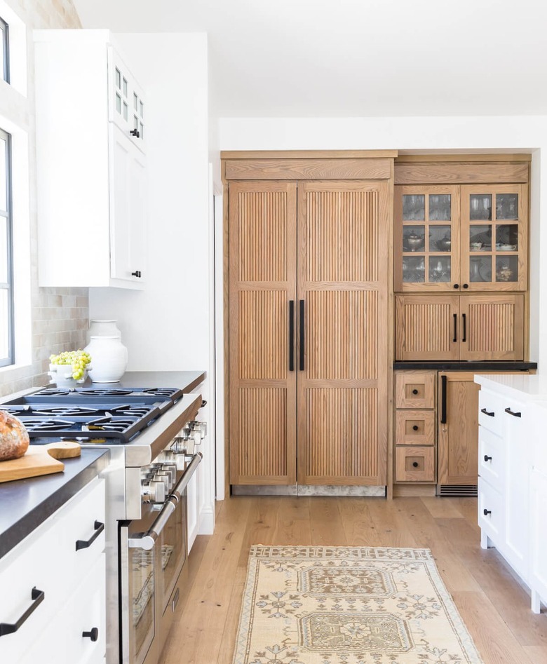 wood reeded cabinets in a white modern farmhouse kitchen