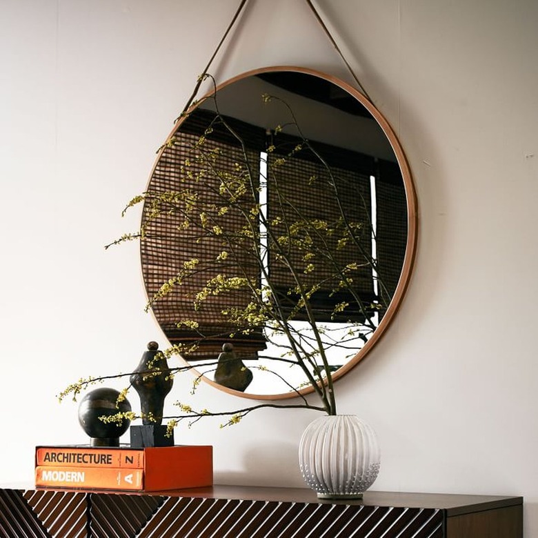 Hanging circle mirror on faux leather string