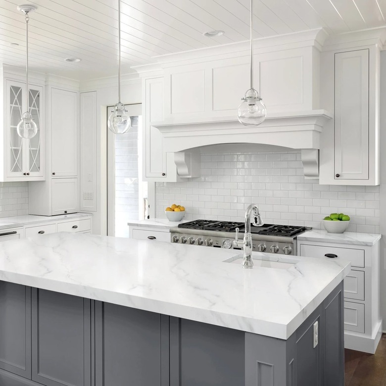 White kitchen with painted marble countertops