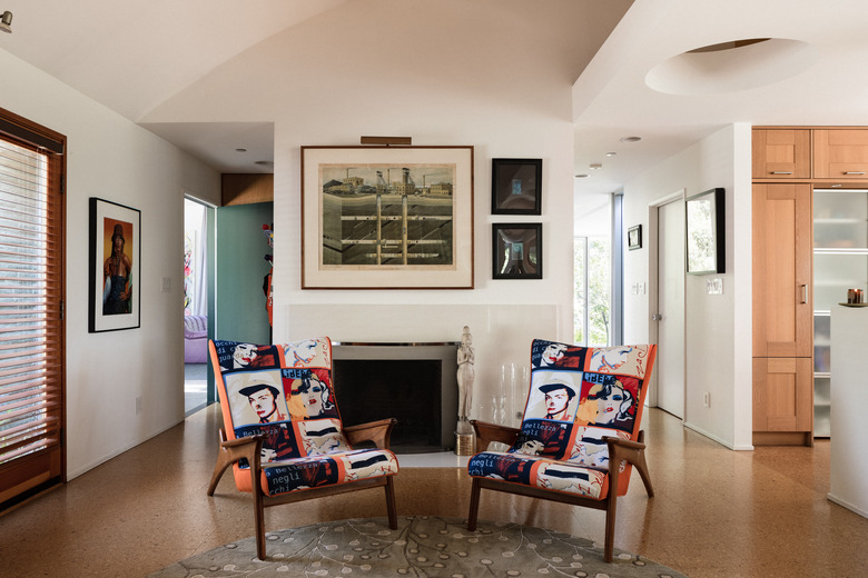 entryway with accent chairs and cork flooring